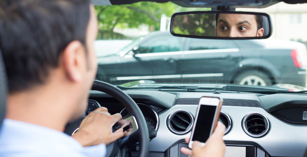 Distracted driver using smartphone 